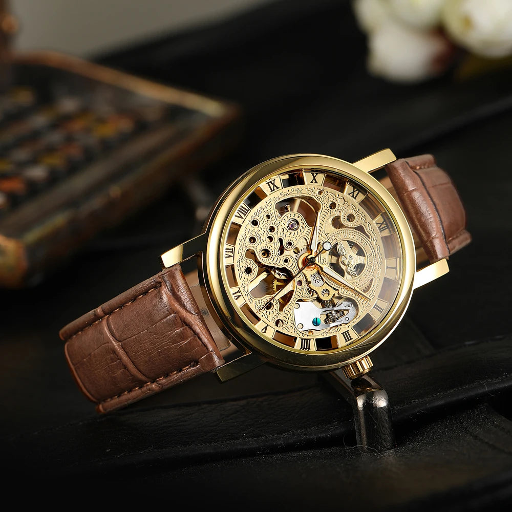 T-Winner Popular Lovers Skeleton Design Gold Watches Mechanical Hand Wind Movement PU Leather Strap Wristwatch for Men Women